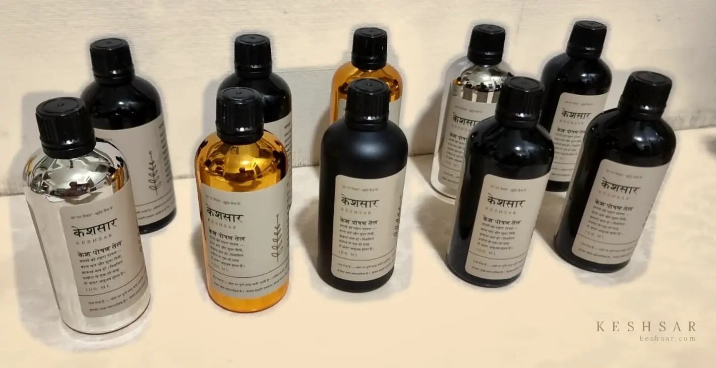 The four KESHSAR bottle finishes — silver, golden, matt black and amber